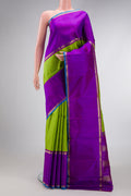 Pure Silk Pure Zari Parrot Green Dual Tone Kanchipuram Saree with Stripes on the body and Zari Border.  displayed on a mannequin