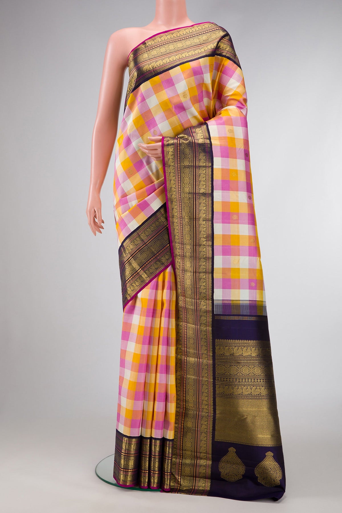 Pure Silk Pure Zari Mustard, Pink and Off White Color Kanjivaram Saree with Checked design on the body and Zari Border.  displayed on a mannequin