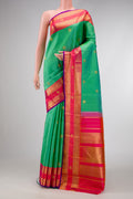 Pure Silk Pure Zari Sea Green Dual Tone Kanjivaram Saree with Zari Butta on the body and Fancy Border.  displayed on a mannequin