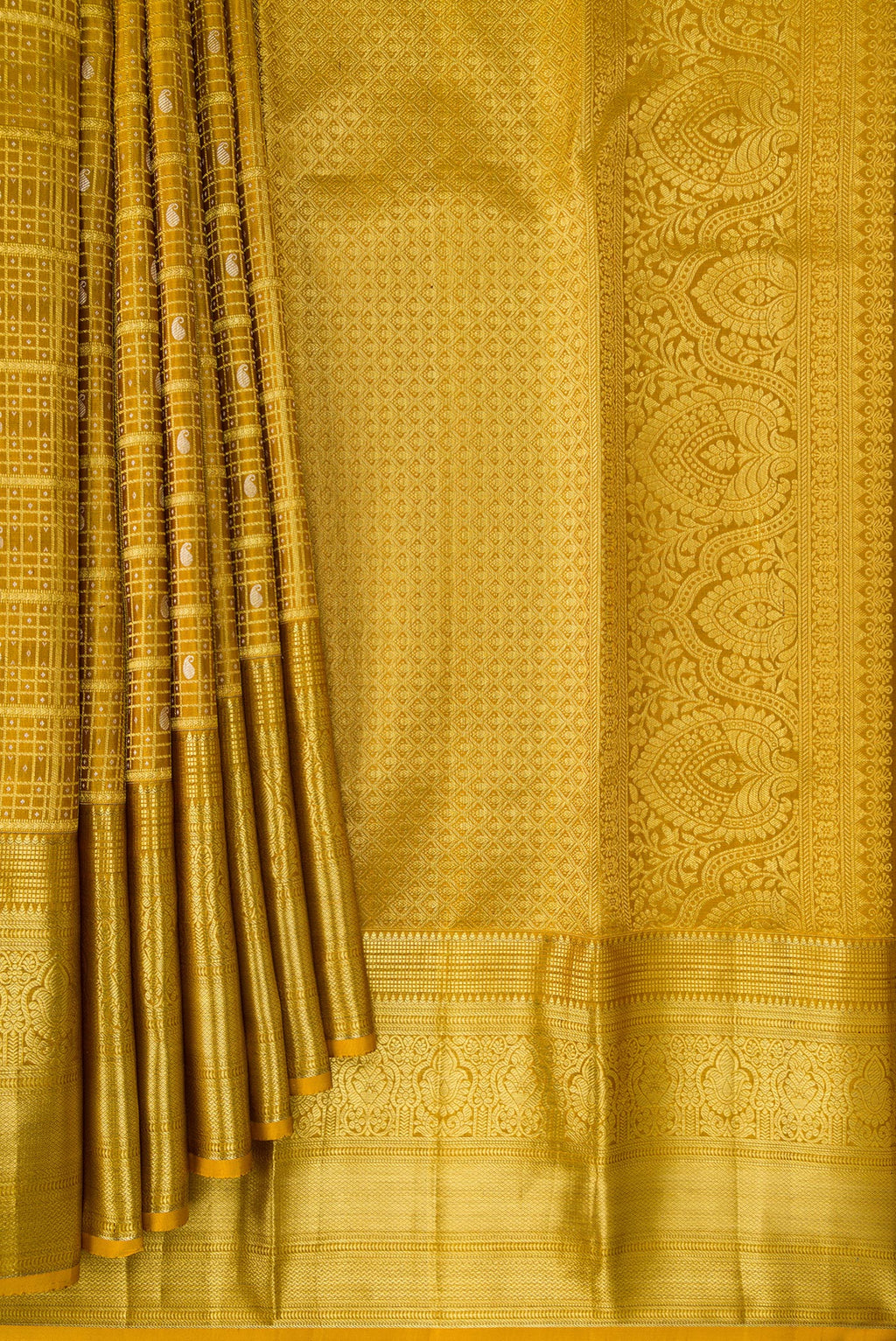 Pleats and pallu of Mustard Kanchipuram Silk Saree with Zari Brocade on the body and Zari Border. 