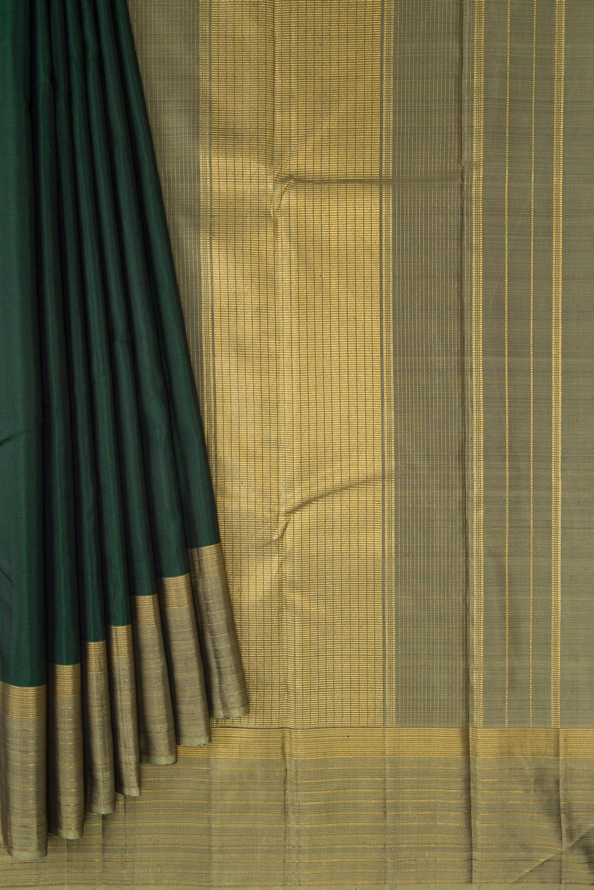 Pleats and pallu of Bottle Green Dual Tone Kanjivaram Silk Saree with Plain Body and Zari Border. 
