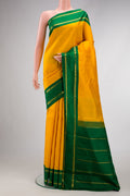 Pure Silk Pure Zari Yellow Dual Tone Kanjivaram Saree with Plain Body and Zari Border.  displayed on a mannequin