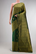 Bottle Green Kanchipuram Silk Saree with Zari Butta on the body and Zari Border.  displayed on a mannequin