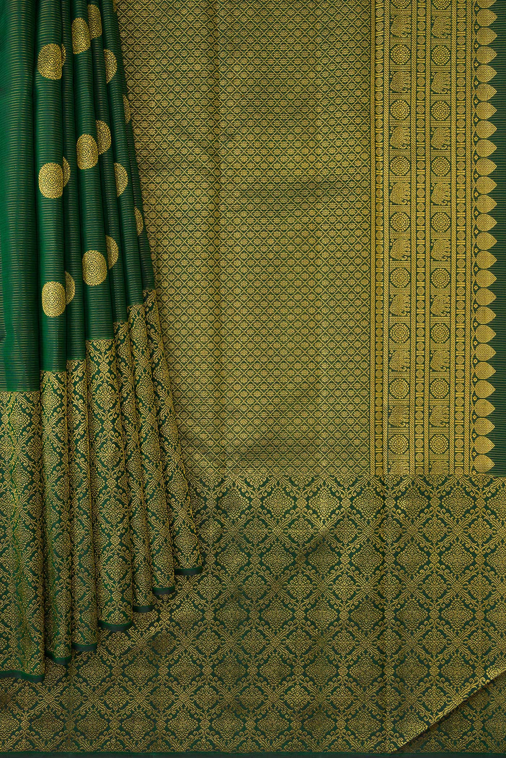 Pleats and pallu of Bottle Green Kanchipuram Silk Saree with Zari Butta on the body and Zari Border. 
