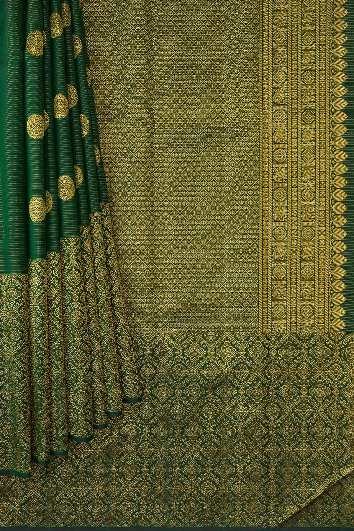 Pleats and pallu of Bottle Green Kanchipuram Silk Saree with Zari Butta on the body and Zari Border. 