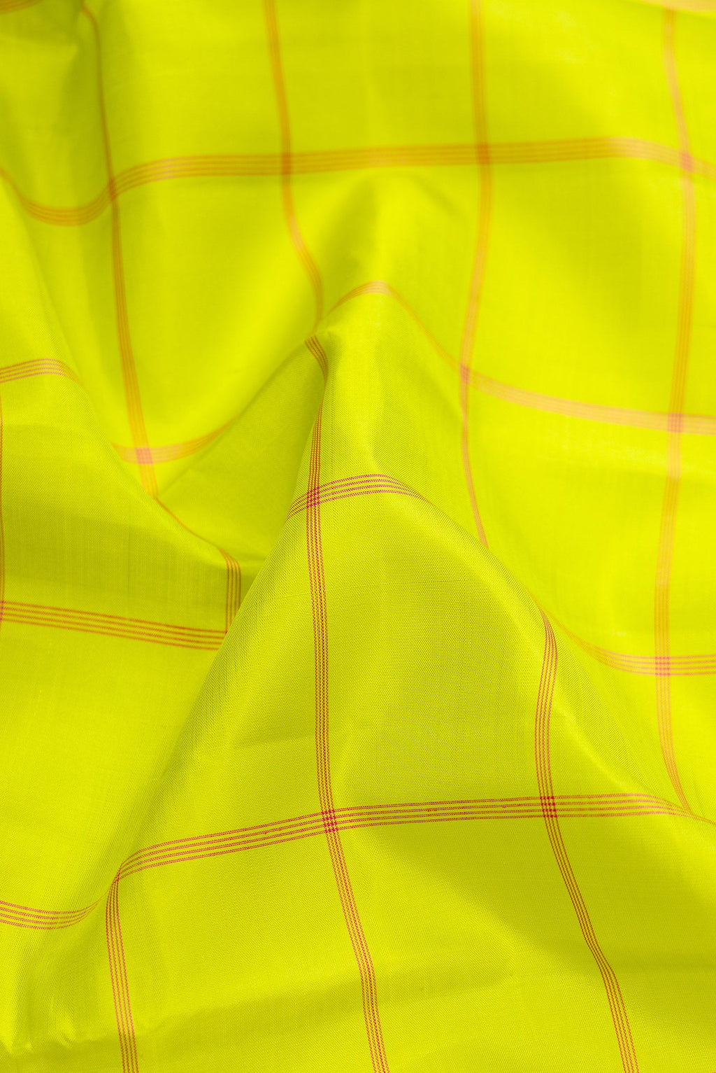 Close up of Parrot Green Dual Tone Kanjivaram Silk Saree with Checked design on the body and Without Border.  displaying folds