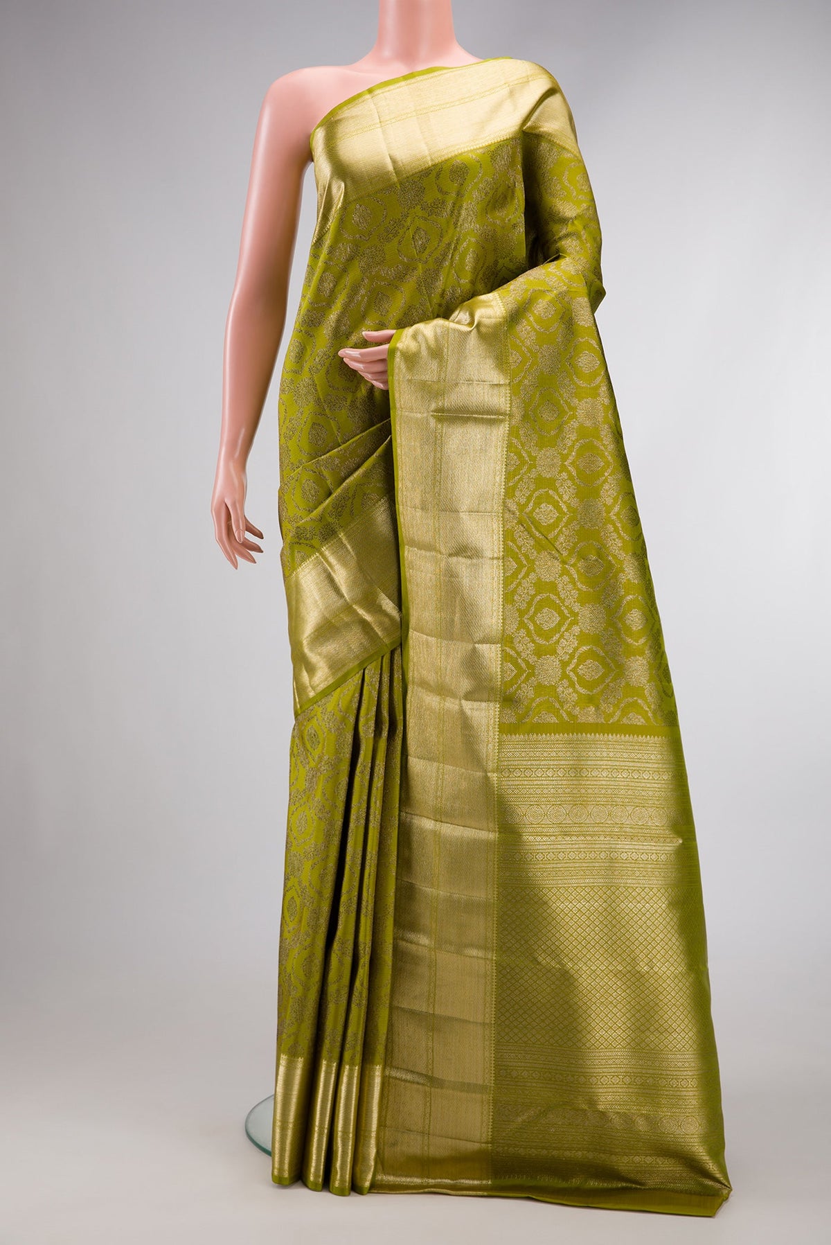 Mehandi Green Dual Tone Kanchipuram Silk Saree with Zari Brocade on the body and Zari Border.  displayed on a mannequin