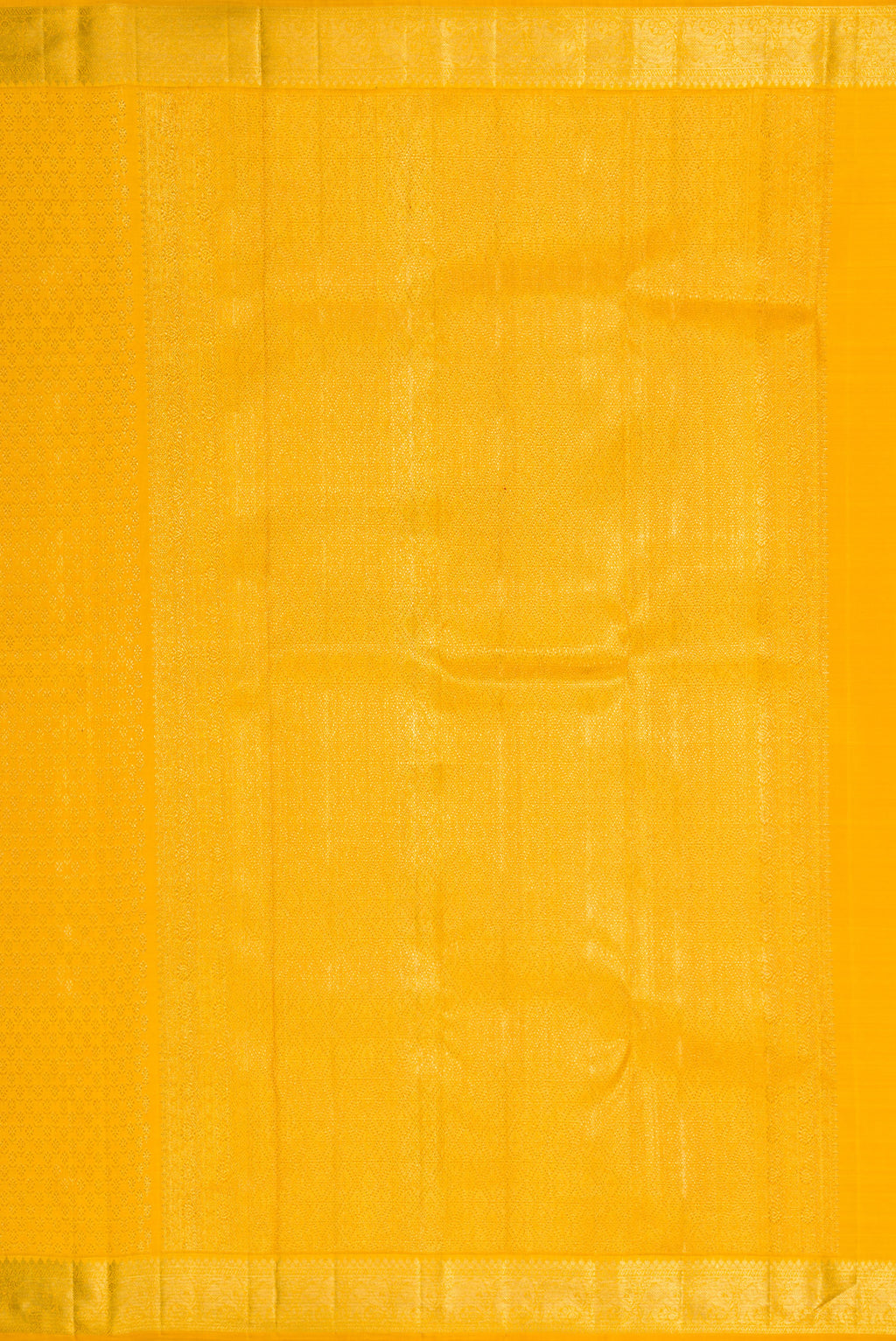 Close up image of the pallu of Yellow Kanchipuram Silk Saree with Zari Brocade on the body and Zari Border. 