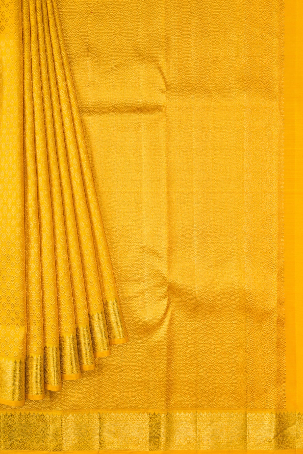 Pleats and pallu of Yellow Kanchipuram Silk Saree with Zari Brocade on the body and Zari Border. 