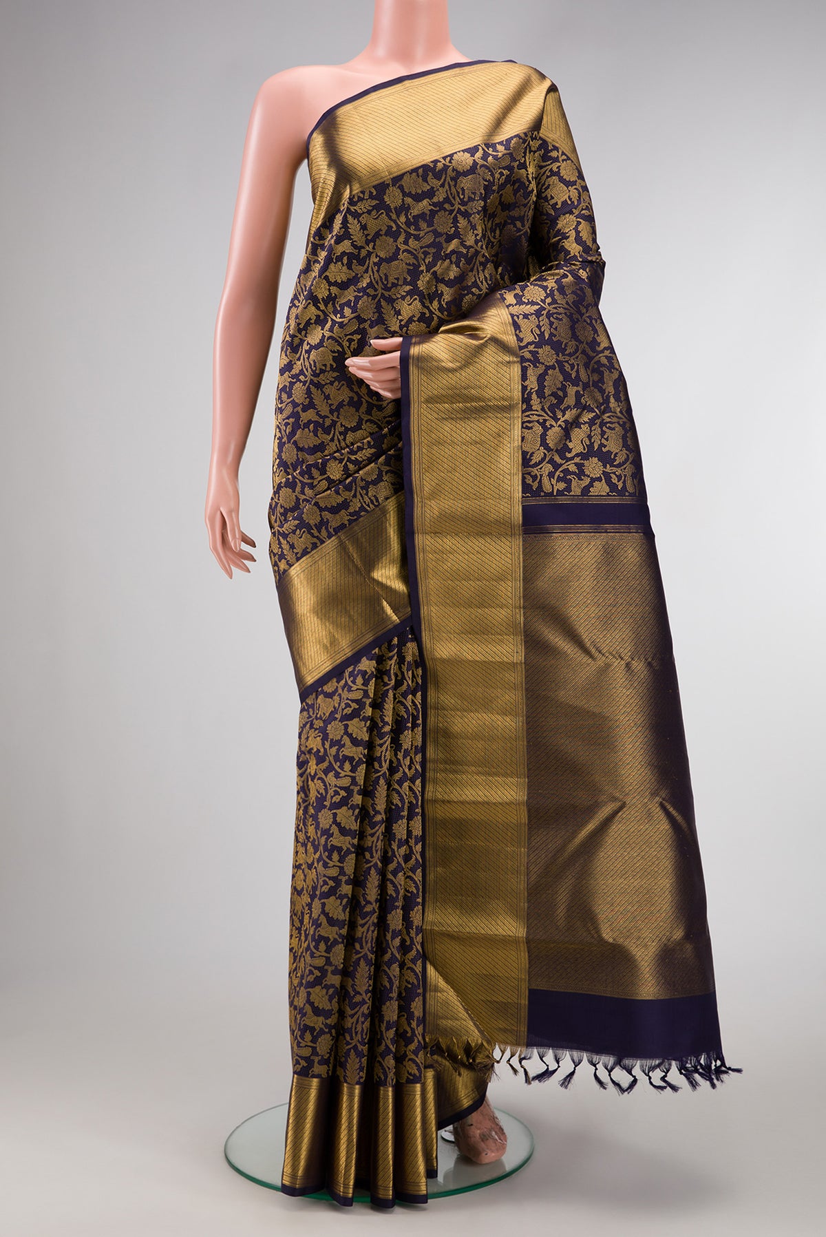 Navy Blue Kanchipuram Silk Saree with Zari Brocade on the body and Zari Border.  displayed on a mannequin