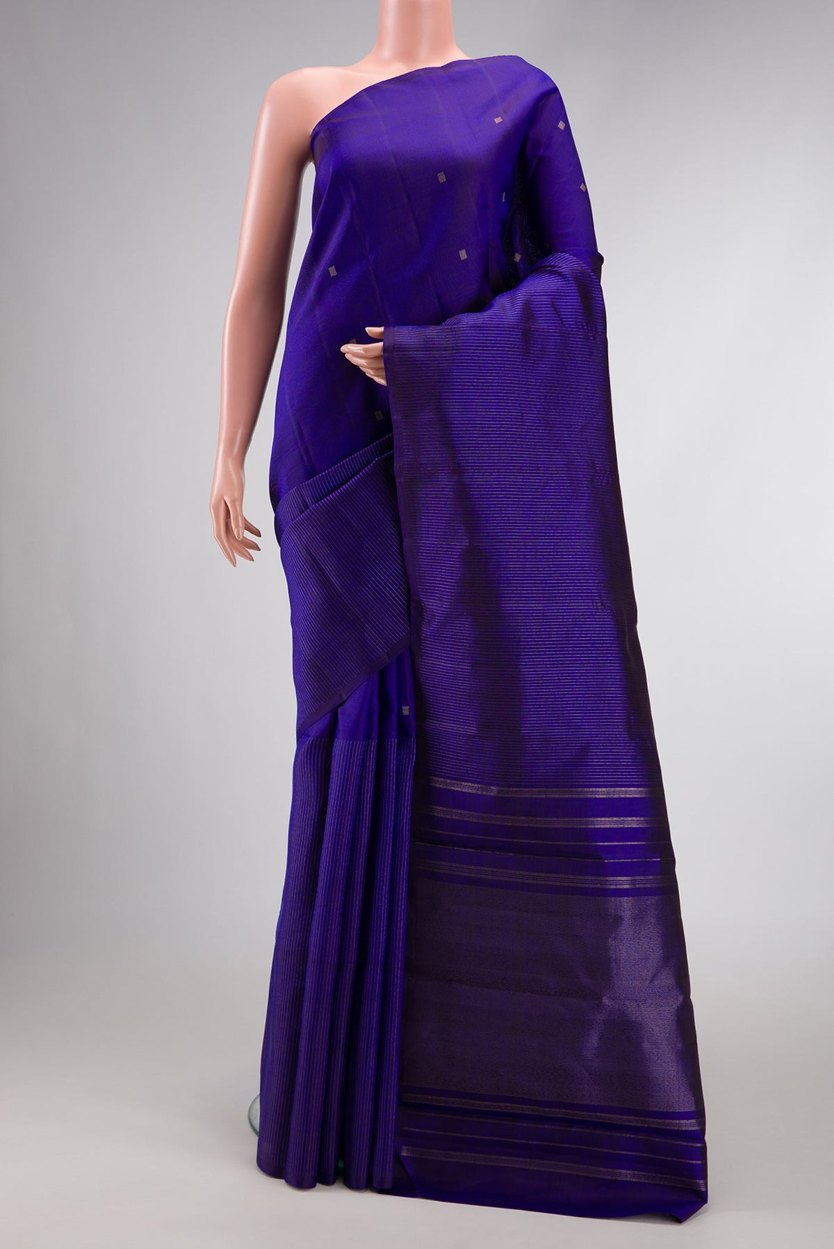 Pure Silk Pure Zari Royal Blue Dual Tone Kanchipuram Saree with Half And Half on the body and Without Border.  displayed on a mannequin