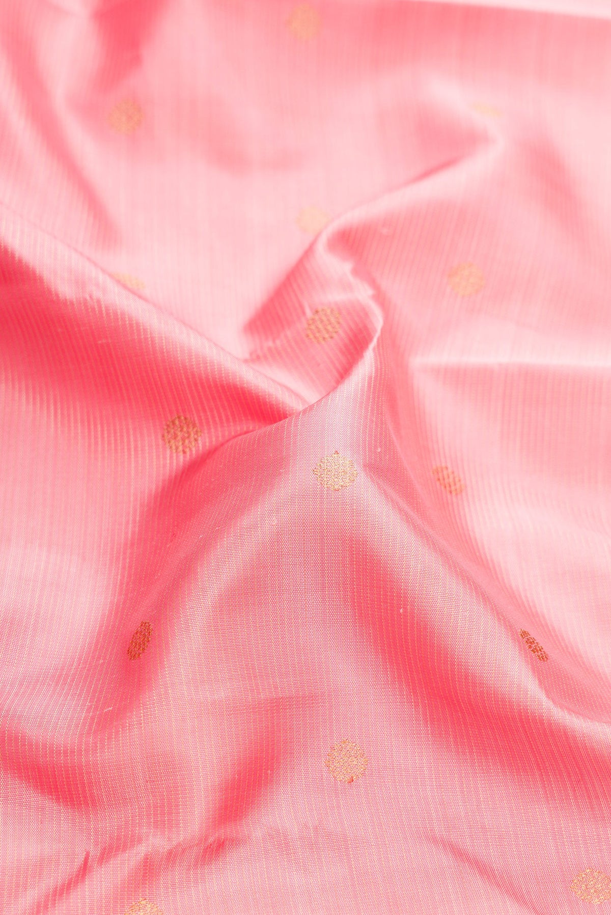 Close up of Pure Silk Pure Zari Pink Dual Tone Kanjivaram Saree with Stripes on the body and Zari Border.  displaying folds