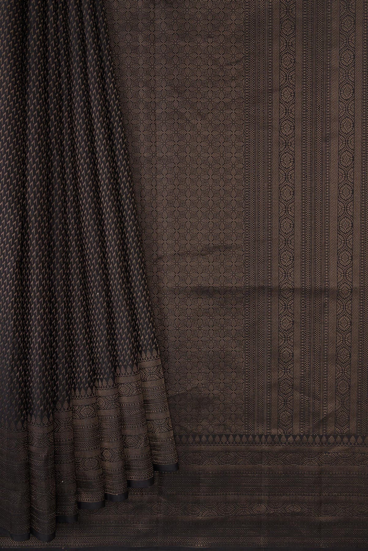 Pleats and pallu of Black Dual Tone Soft Silk Saree with Zari Brocade on the body and Fancy Border. 