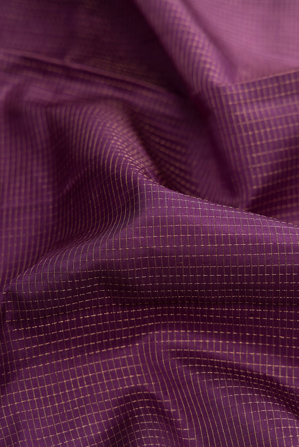 Close up of Purple Dual Tone Soft Silk Saree with Zari Brocade on the body and Fancy Border.  displaying folds