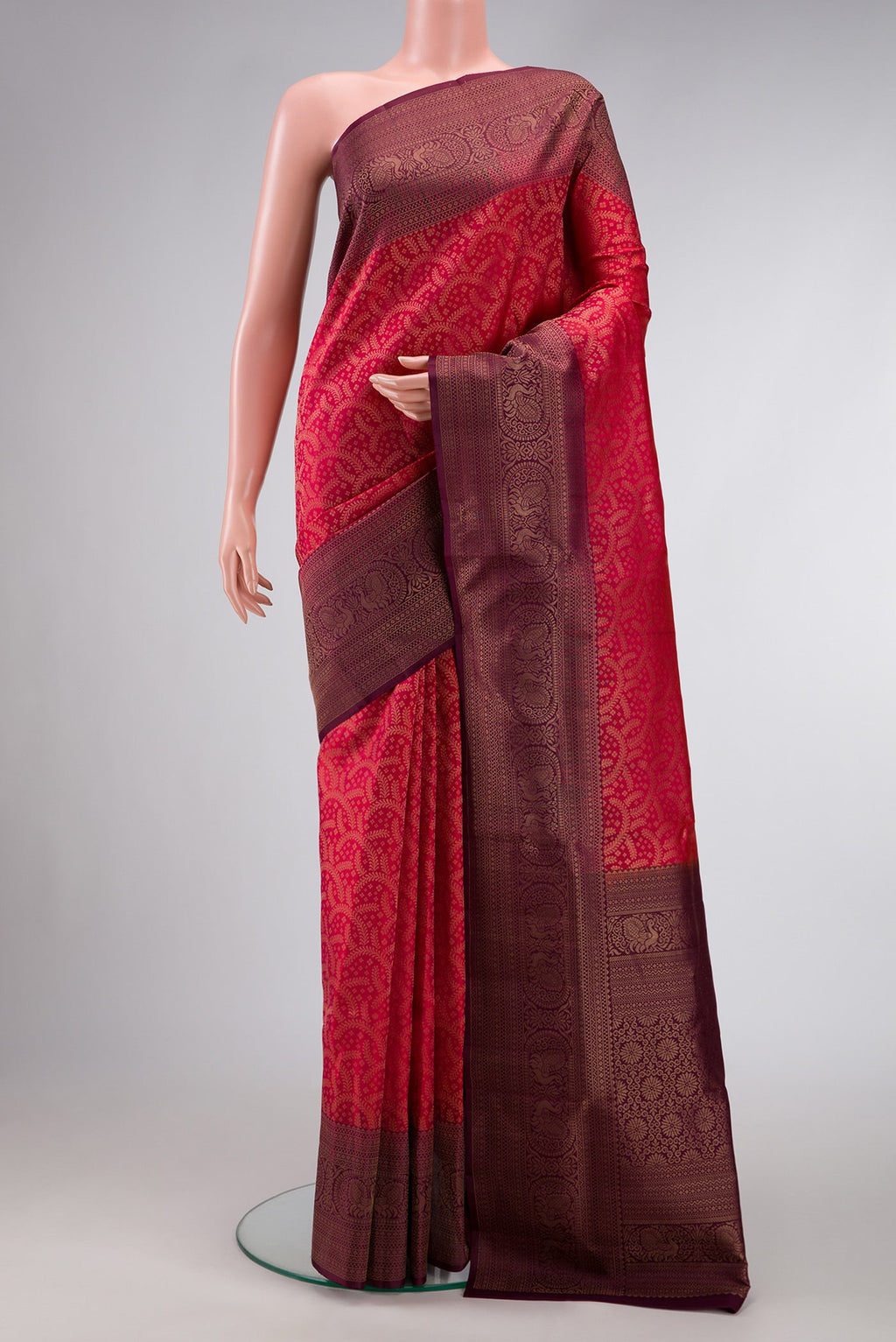 Brick Orange Dual Tone Soft Silk Saree with Zari Brocade on the body and Fancy Border.  displayed on a mannequin