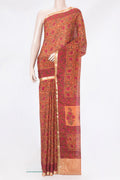 Orange Crepe Saree with Printed design on the body and Zari Border.  displayed on a mannequin