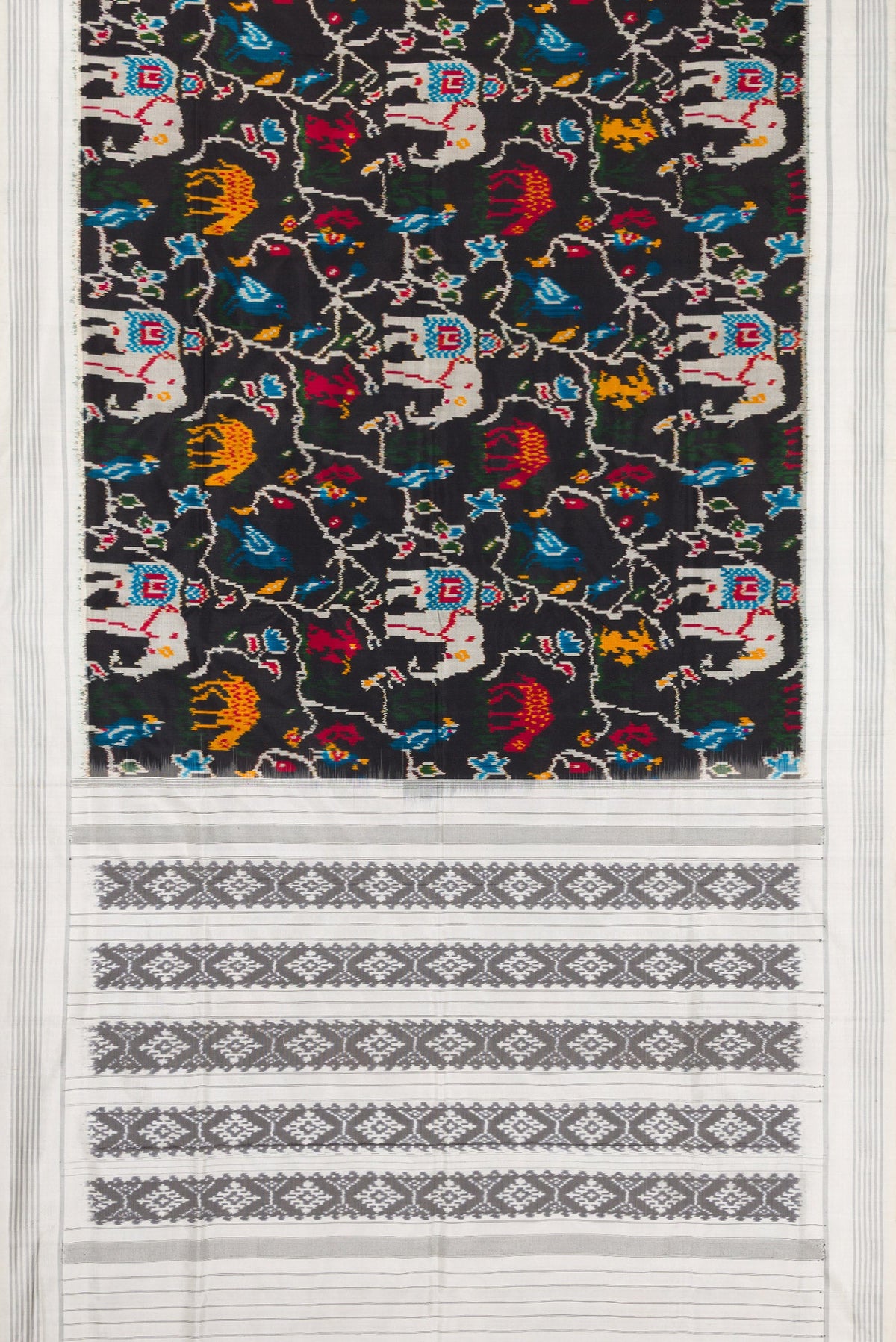 Flat view of Black Dual Tone Double Ikat Saree with Ikat Print on the body and Thread Border. 