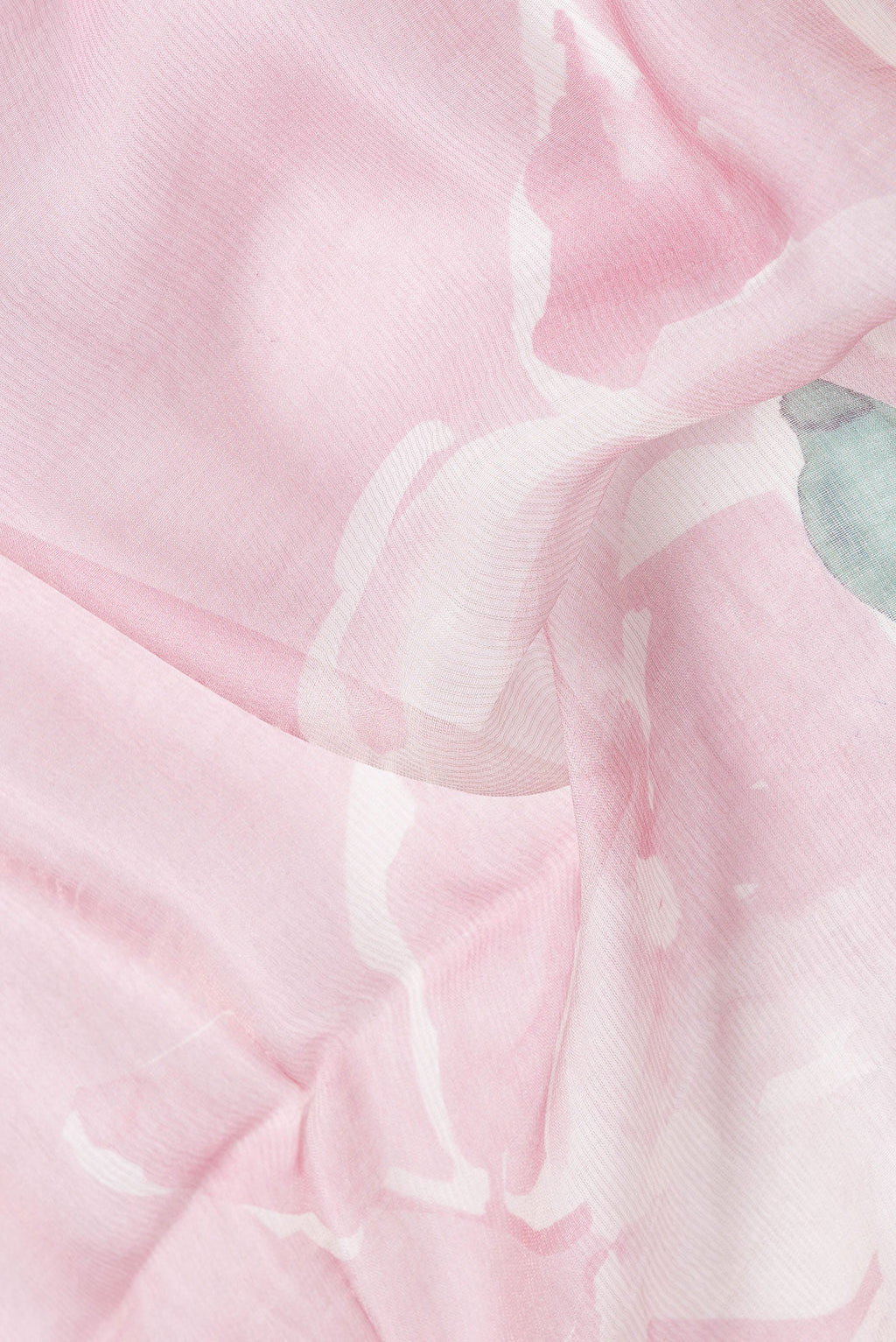 Close up of Pink Dual Tone Tussar Silk Saree with Printed design on the body and Embroidery Border.  displaying folds