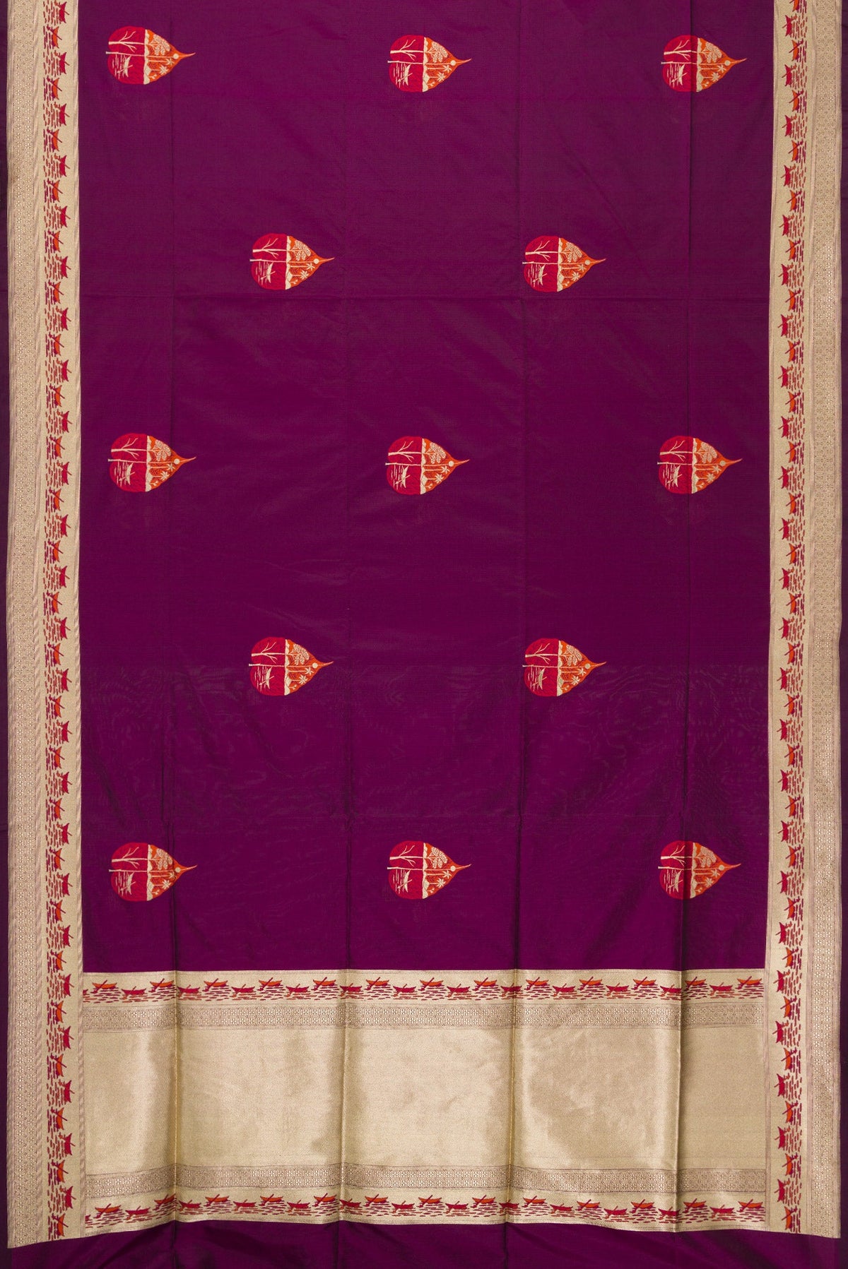 Flat view of Burgundy Dual Tone Banarasi Silk Saree with Zari And Thread Butta on the body and Fancy Border. 