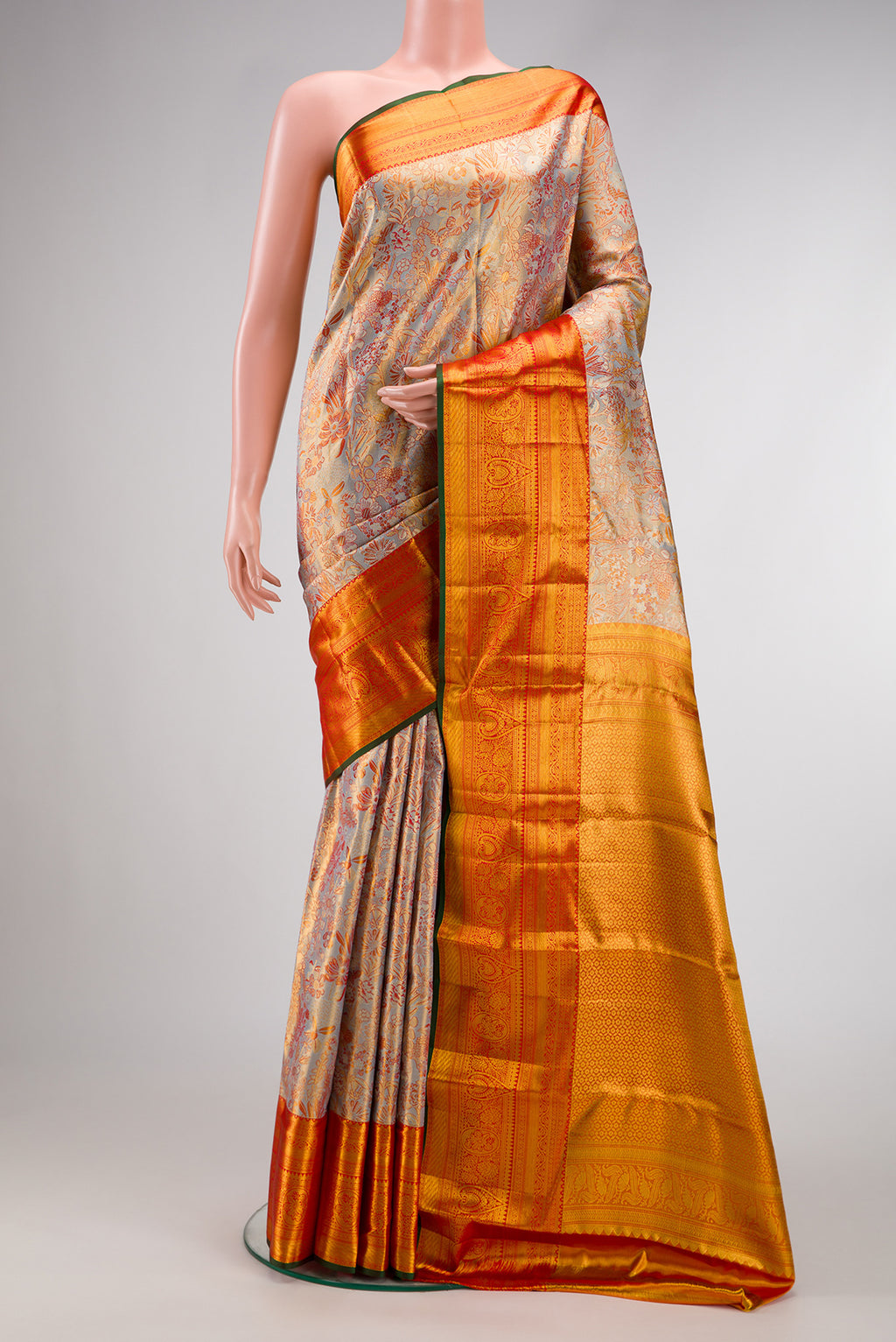 Lilac with Gold Color Kanjivaram Tissue Silk Saree with Zari Brocade on the body and Zari Border.  displayed on a mannequin