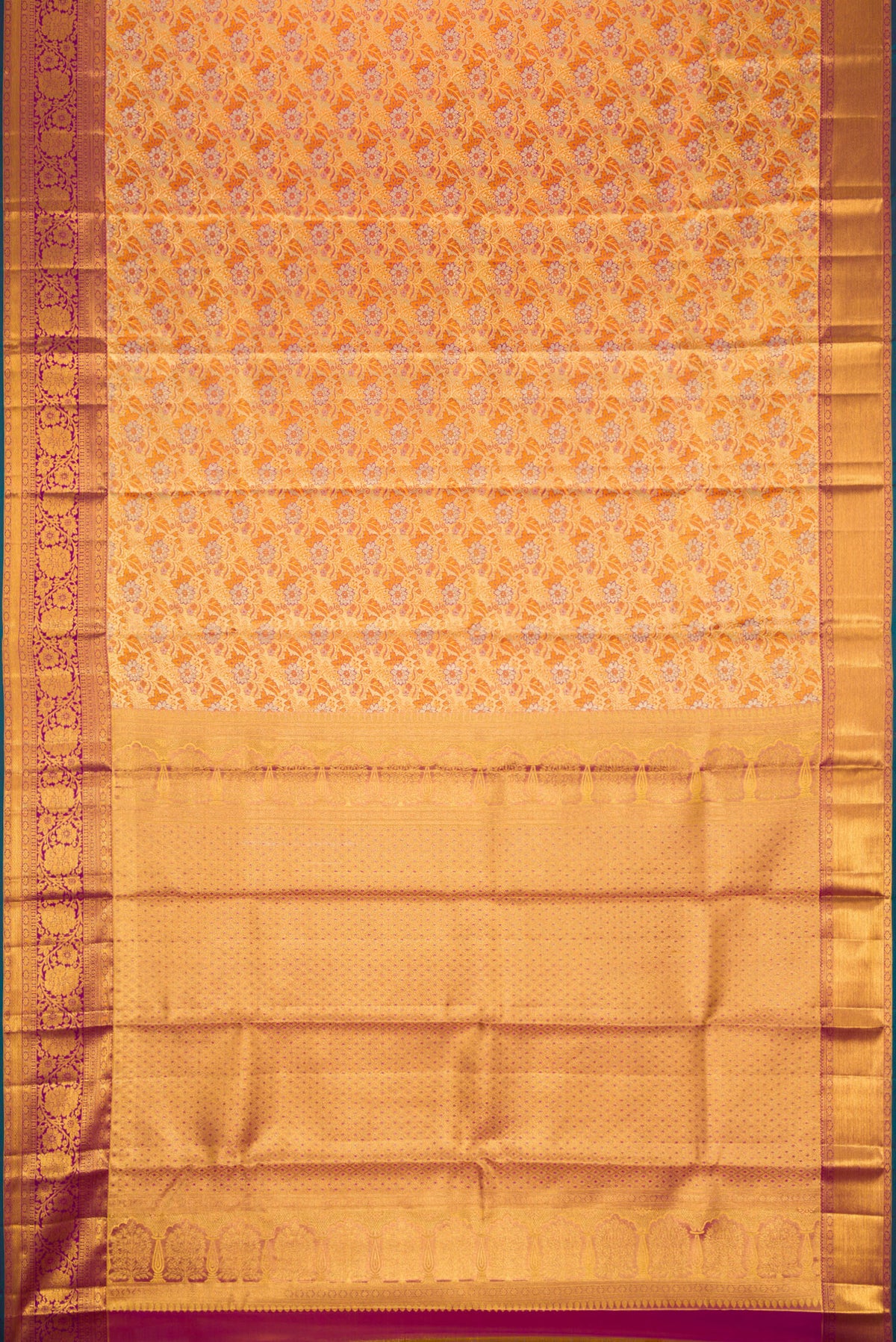 Flat view of Gold Dual Tone Kanjivaram Tissue Silk Saree with Zari Brocade on the body and Zari Border. 