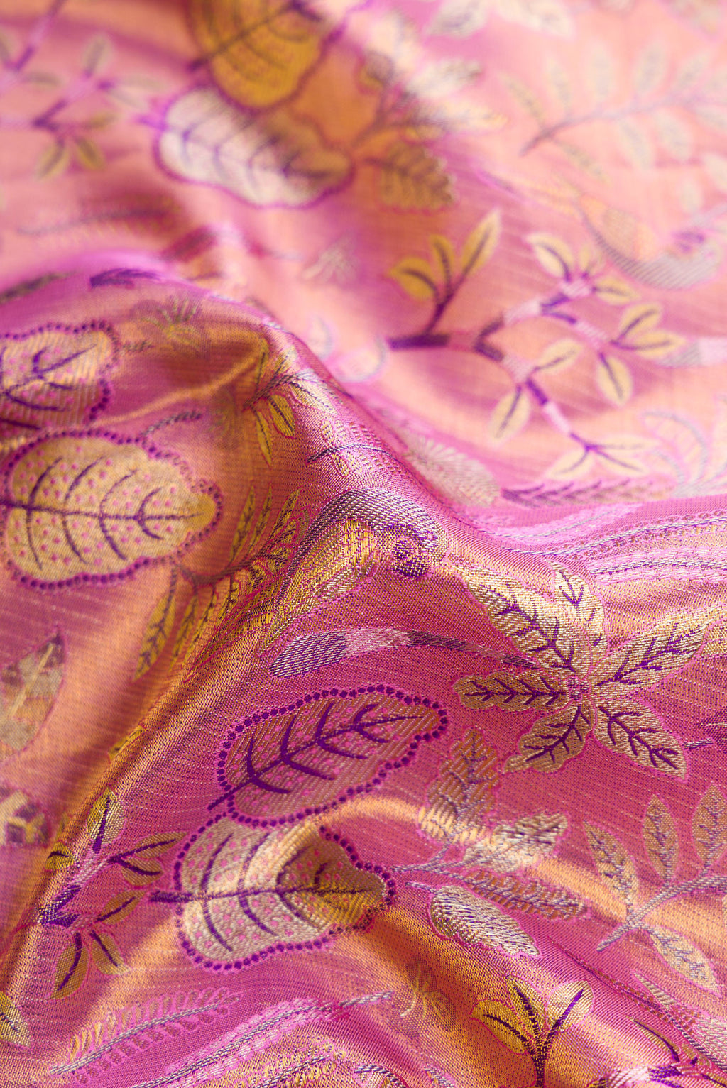 Close up of Lavender Dual Tone Kanjivaram Tissue Silk Saree with Zari Brocade on the body and Zari Border.  displaying folds