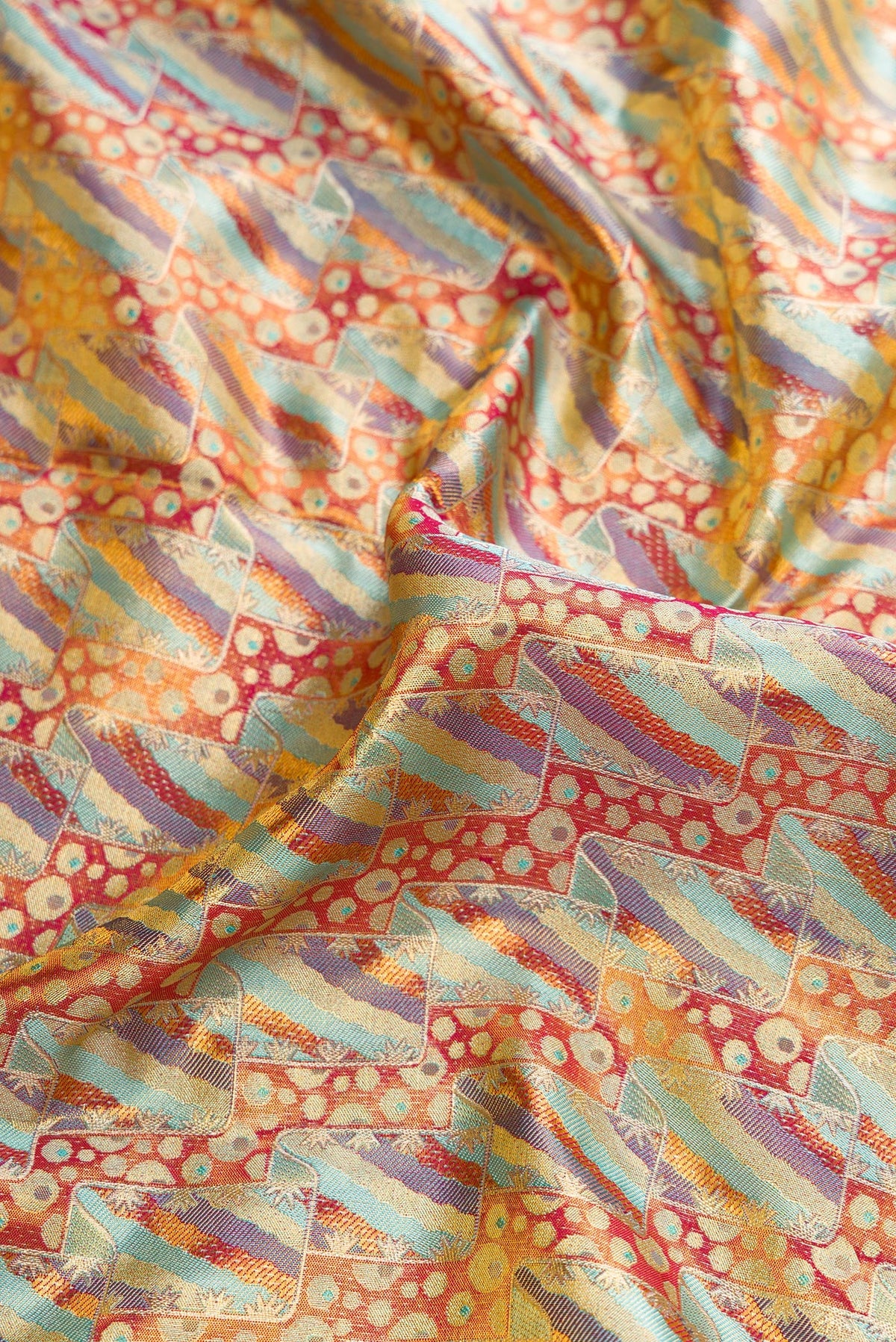 Close up of Sky Blue Dual Tone Kanjivaram Tissue Silk Saree with Zari Brocade on the body and Zari Border.  displaying folds
