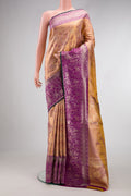 Peach Dual Tone Kanjivaram Tissue Silk Saree with Zari Brocade on the body and Zari Border.  displayed on a mannequin