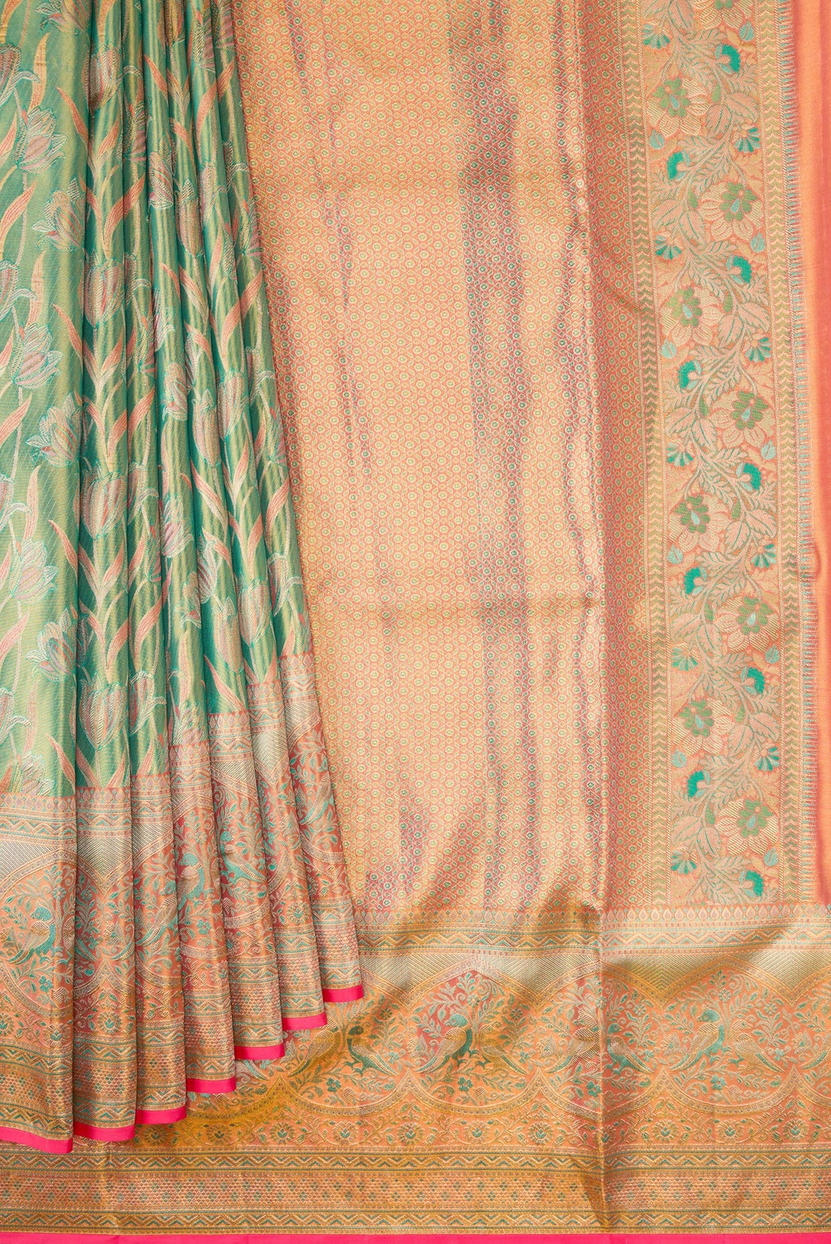 Pleats and pallu of Green Kanjivaram Tissue Silk Saree with Zari Brocade on the body and Fancy Border. 