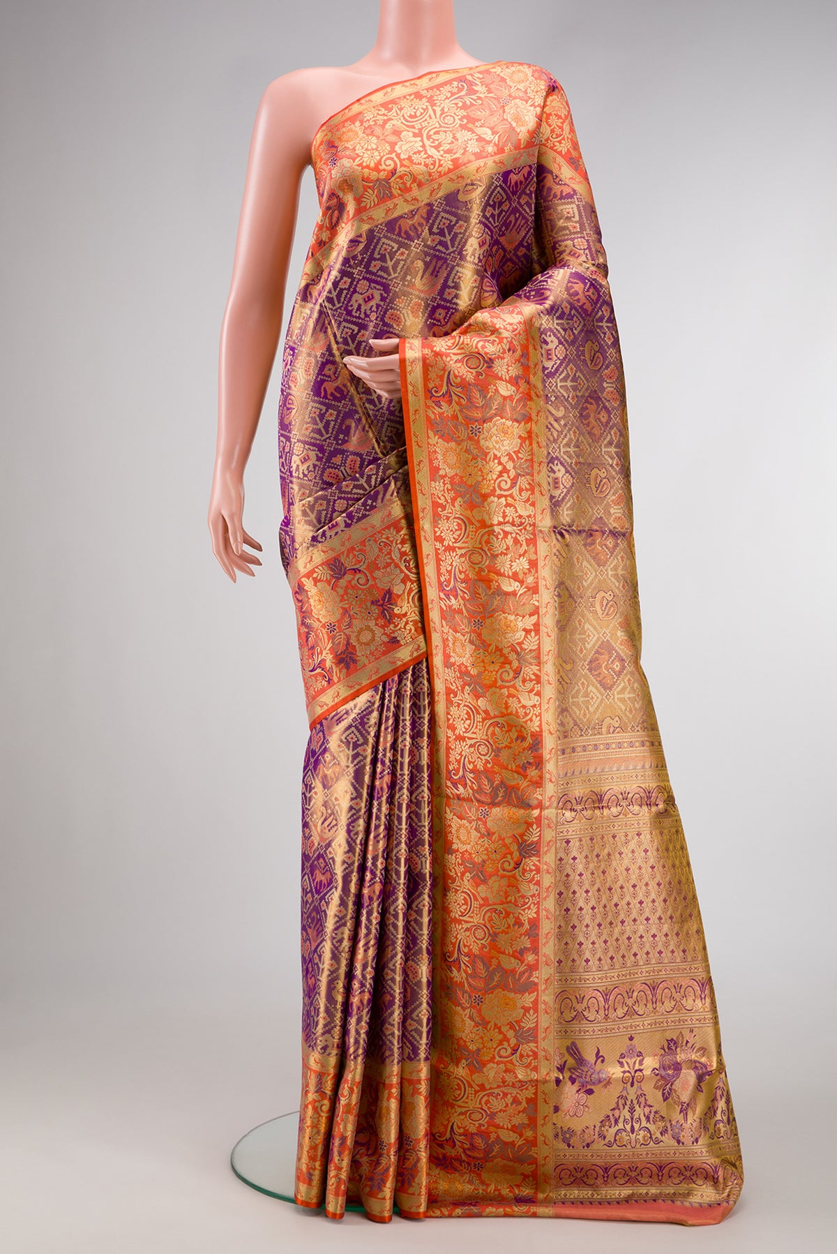 Purple Dual Tone Kanjivaram Tissue Silk Saree with Zari Brocade on the body and Zari Border.  displayed on a mannequin