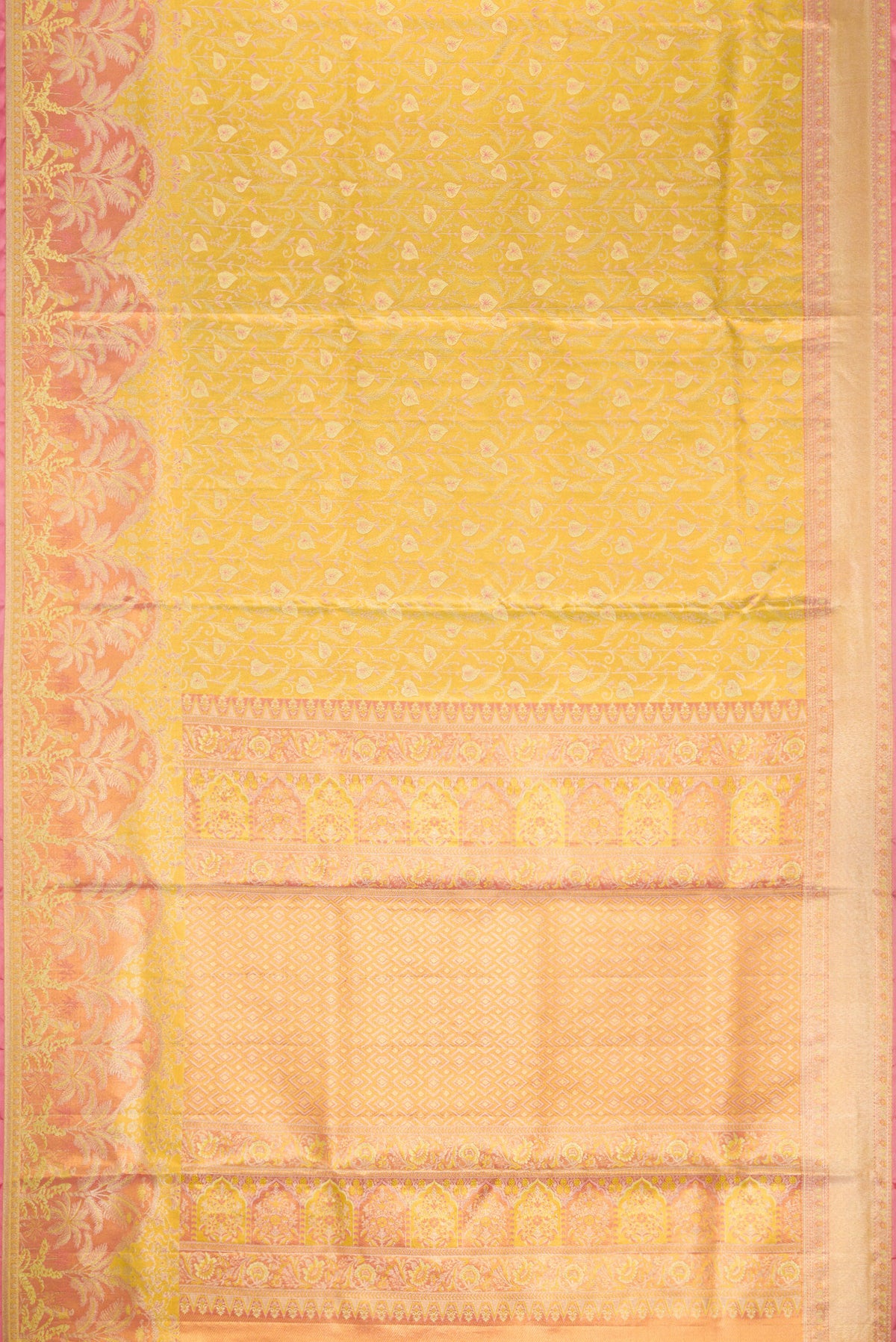 Flat view of Yellow Kanjivaram Tissue Silk Saree with Zari Brocade on the body and Fancy Border. 