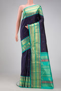 Royal Blue Dual Tone Kanjivaram Silk Saree with Zari Butta on the body and Zari Border.  displayed on a mannequin
