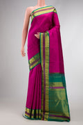 Magenta Dual Tone Kanjivaram Silk Saree with Plain Body and Zari Border.  displayed on a mannequin