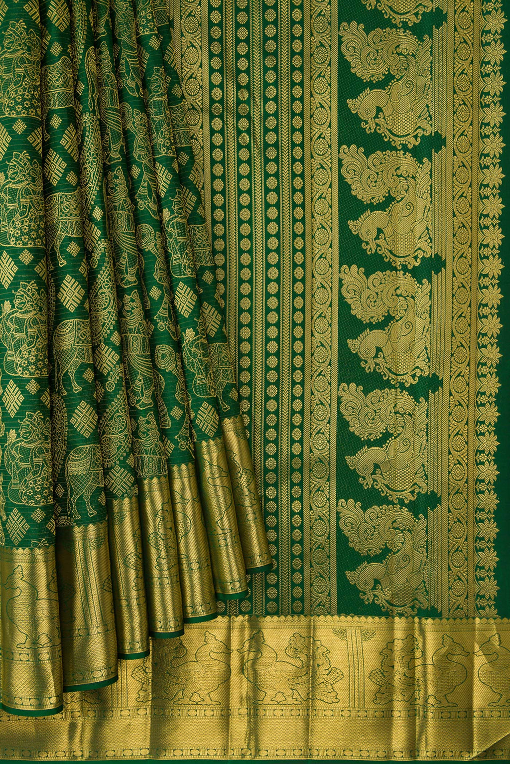 Pleats and pallu of Green Kanchipuram Silk Saree with Zari Butta on the body and Zari Border. 