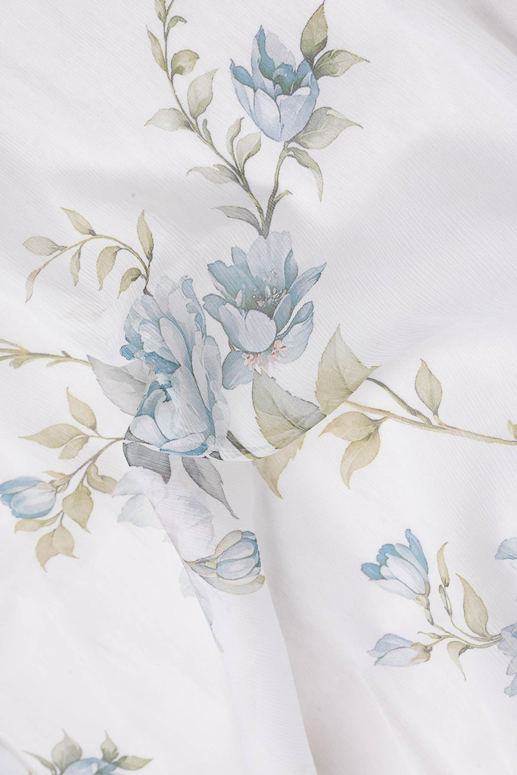Close up of Off White Dual Tone Mysore Chiffon Saree with Printed design on the body and Plain Border.  displaying folds