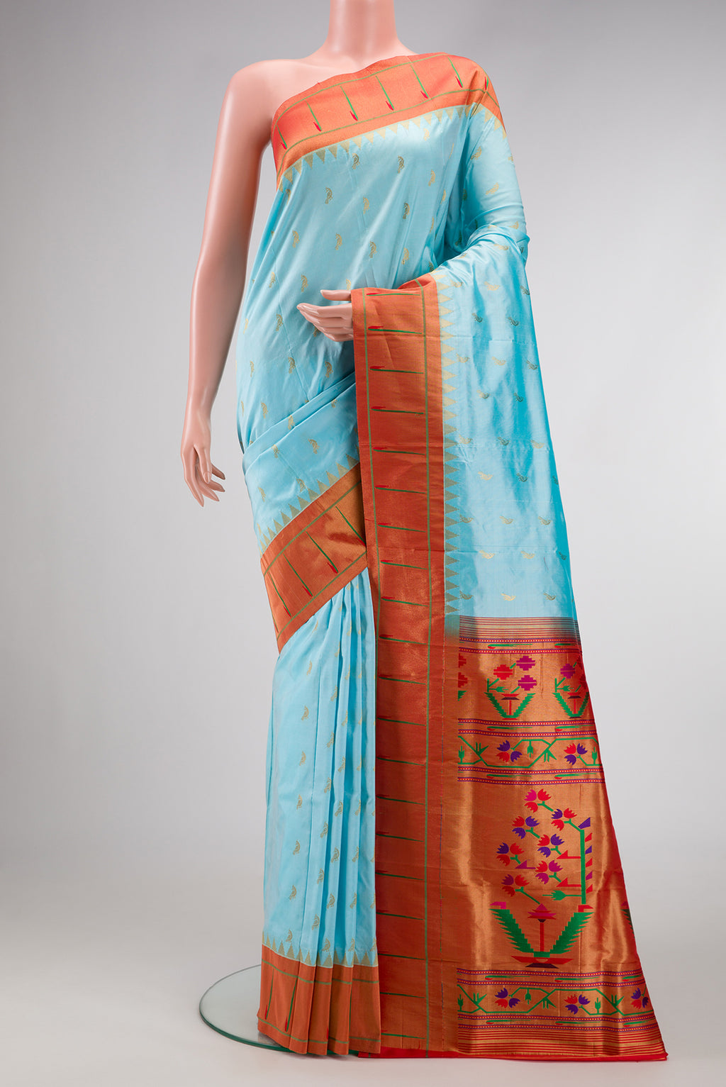 Sky Blue Paithani Silk Saree with Zari Butta on the body and Paithani Border.  displayed on a mannequin