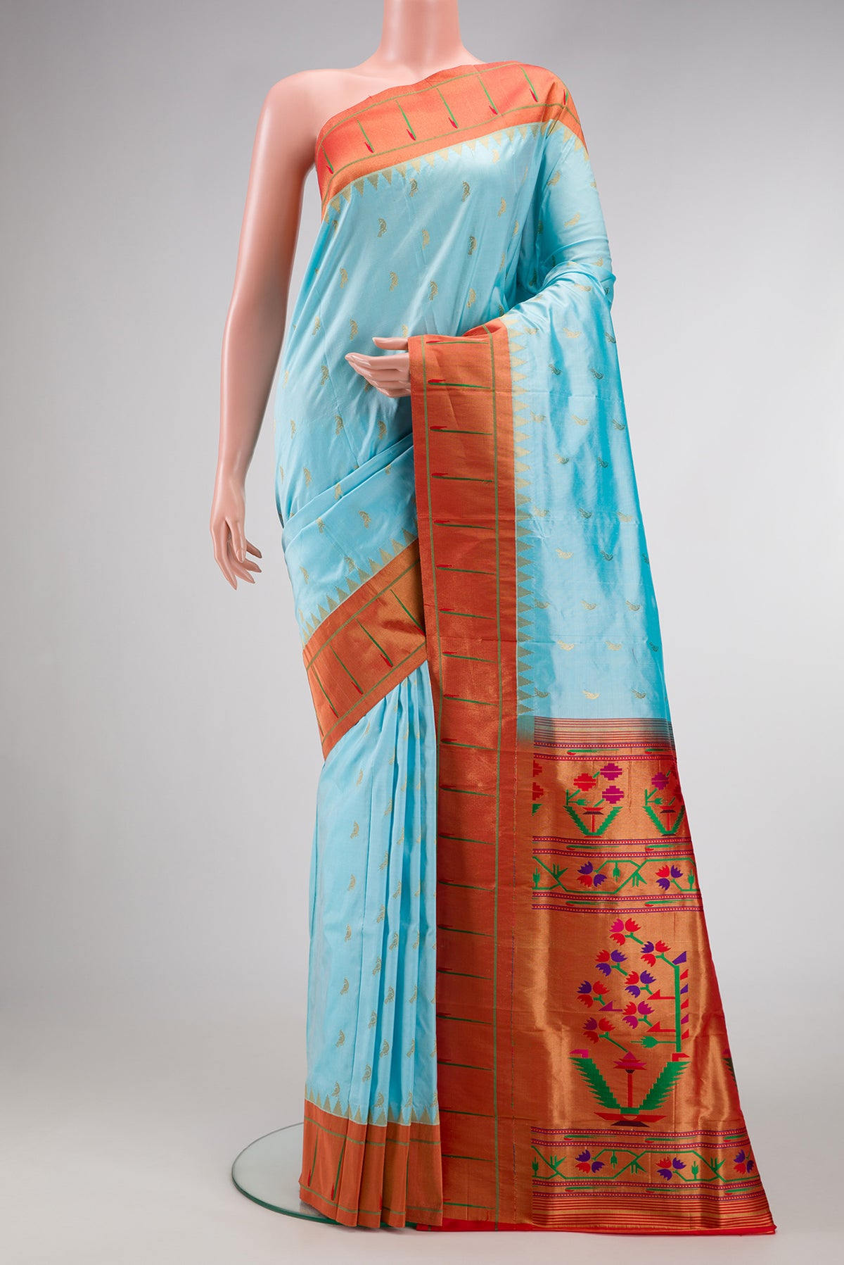 Sky Blue Paithani Silk Saree with Zari Butta on the body and Paithani Border.  displayed on a mannequin