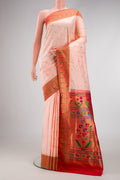 Peach Paithani Silk Saree with Zari Butta on the body and Paithani Border.  displayed on a mannequin