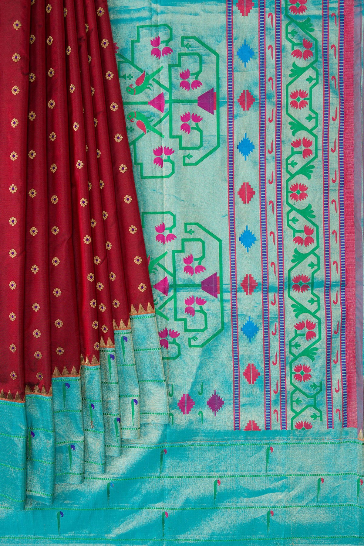 Pleats and pallu of Maroon Paithani Silk Saree with Zari Butta on the body and Paithani Border. 