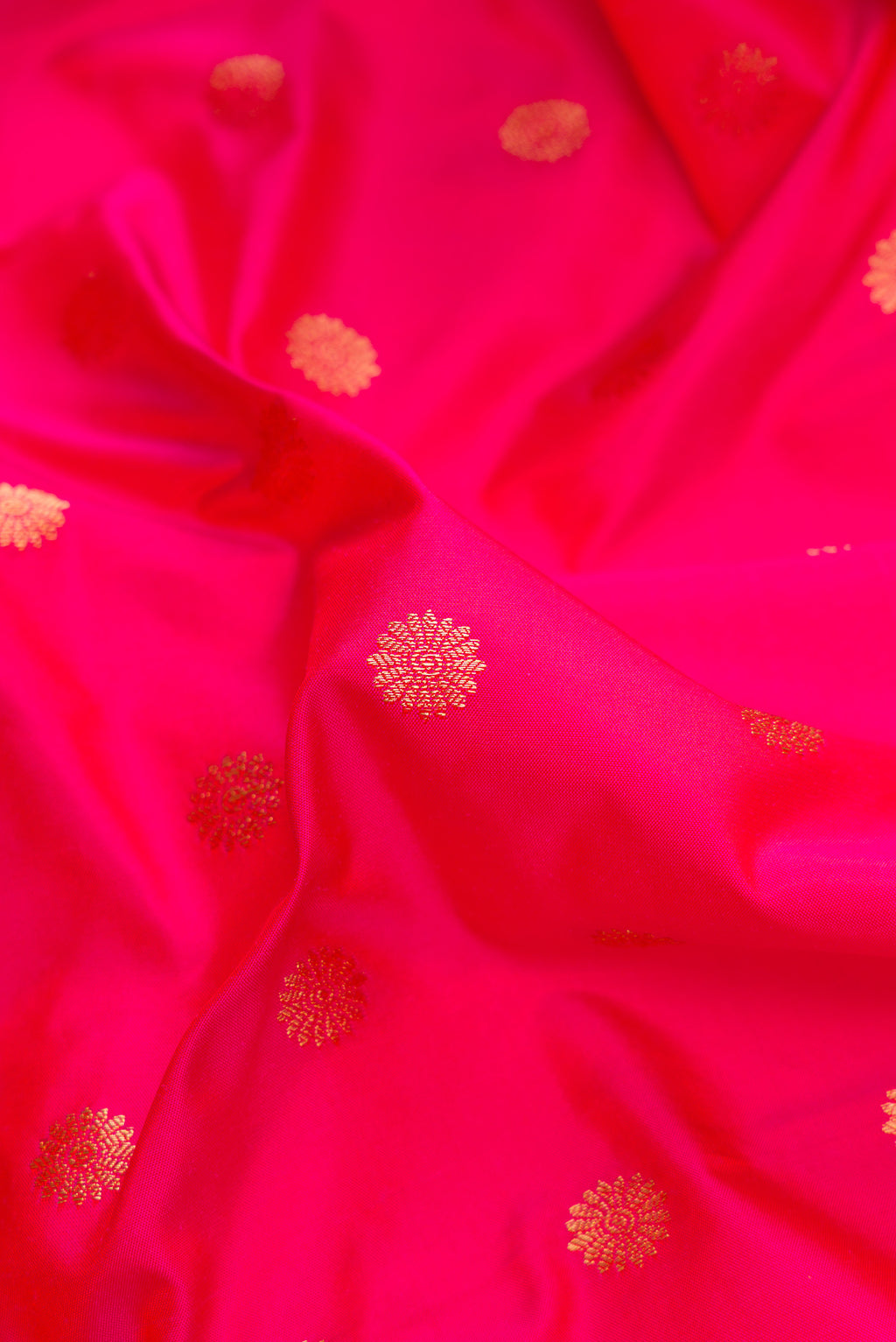 Close up of Pink Paithani Silk Saree with Zari Butta on the body and Paithani Border.  displaying folds