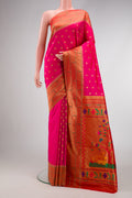 Pink Paithani Silk Saree with Zari Butta on the body and Paithani Border.  displayed on a mannequin