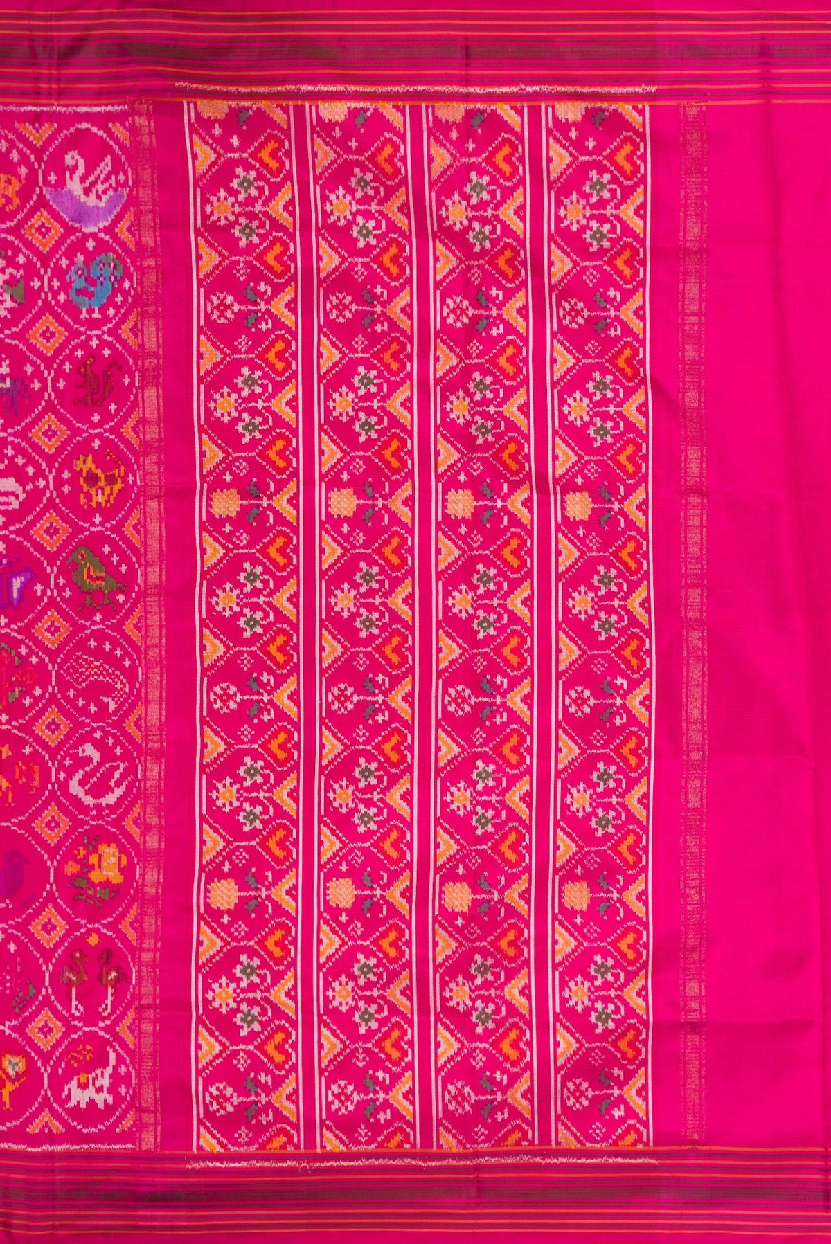 Close up image of the pallu of Pink Dual Tone Double Ikat Saree with Ikat Print on the body and Ikat Border. 
