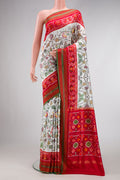Off White Dual Tone Double Ikat Saree with Ikat Print on the body and Ikat Border.  displayed on a mannequin