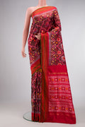 Maroon Dual Tone Double Ikat Saree with Ikat Print on the body and Zari Border.  displayed on a mannequin