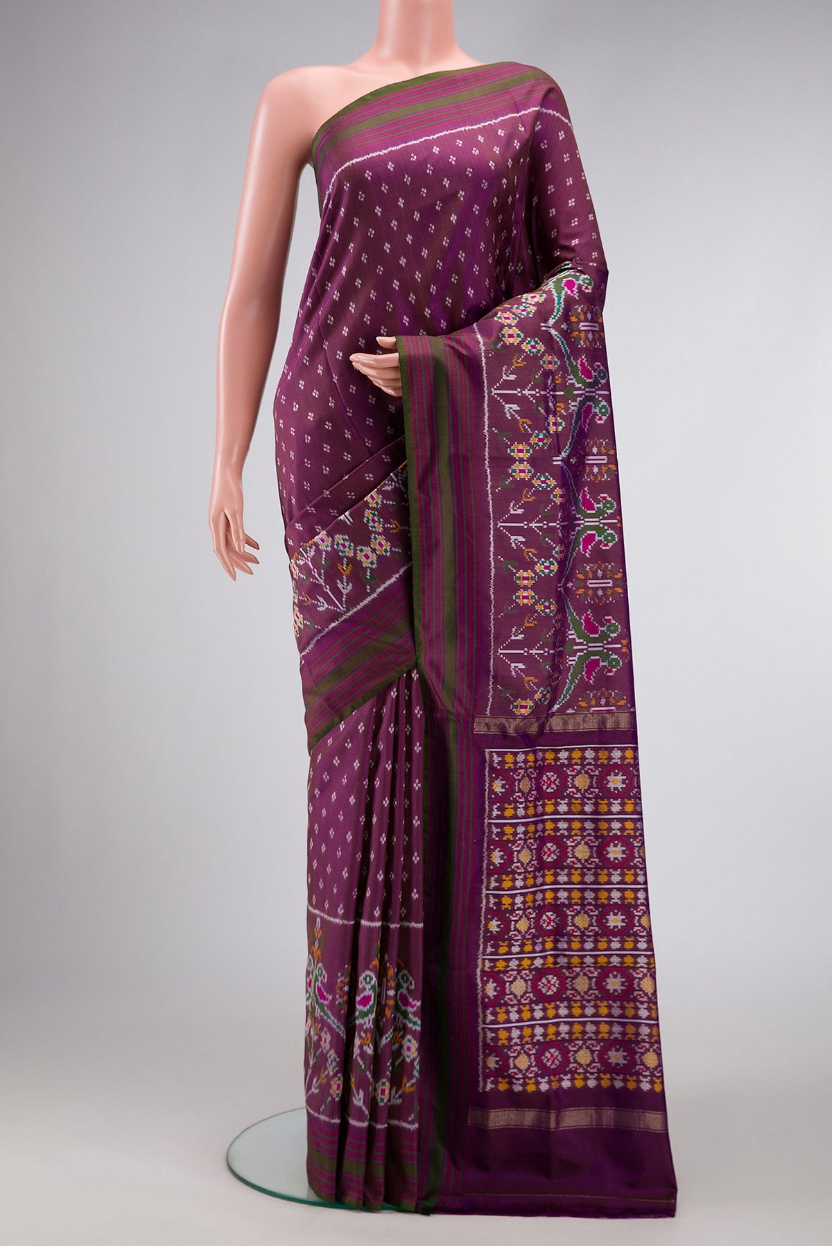 Purple Dual Tone Double Ikat Saree with Ikat Print on the body and Zari Border.  displayed on a mannequin