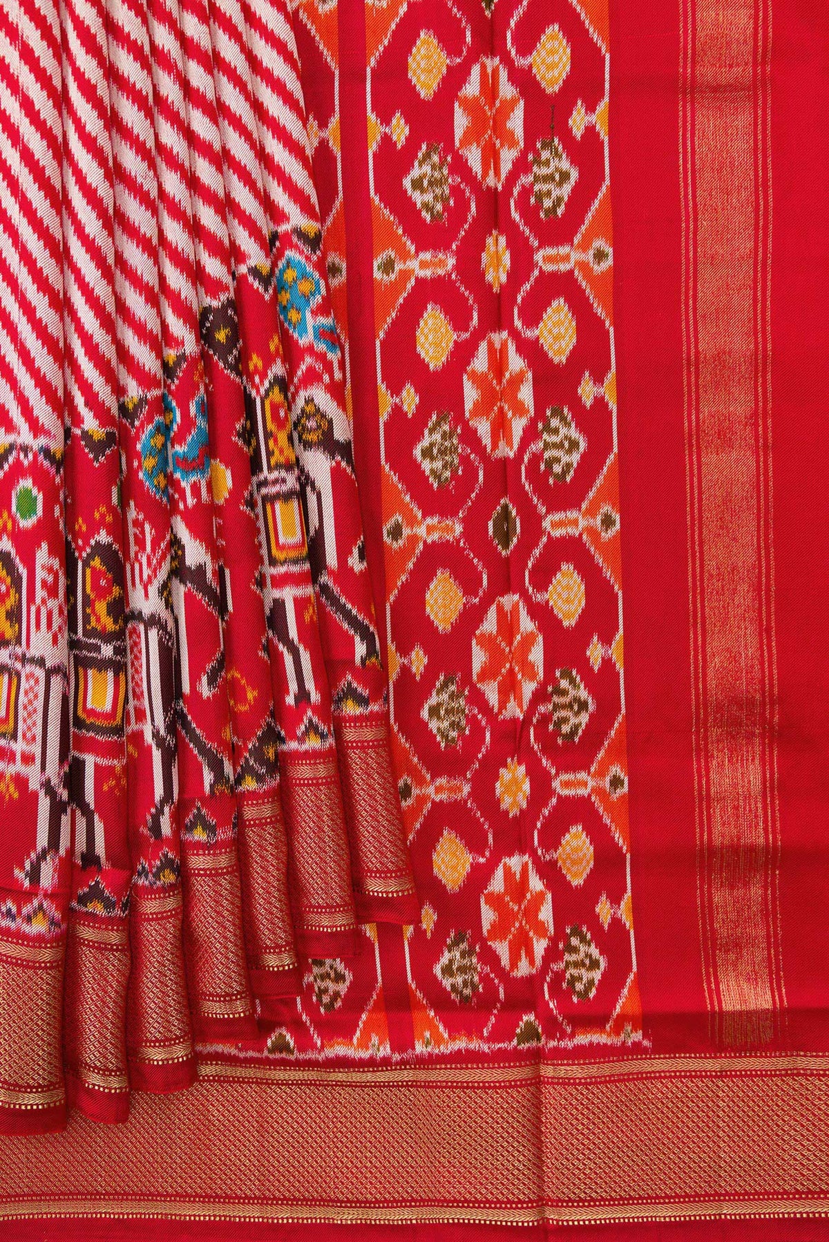 Pleats and pallu of Red Dual Tone Double Ikat Saree with Ikat Print on the body and Zari Border. 