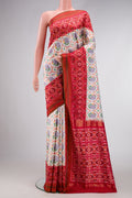 Off White Dual Tone Double Ikat Saree with Ikat Print on the body and Ikat Border.  displayed on a mannequin