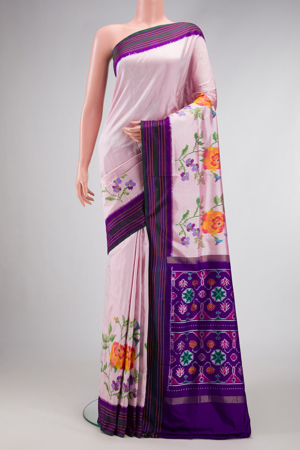 Pink Double Ikat Saree with Plain Body and Ikat Border.  displayed on a mannequin