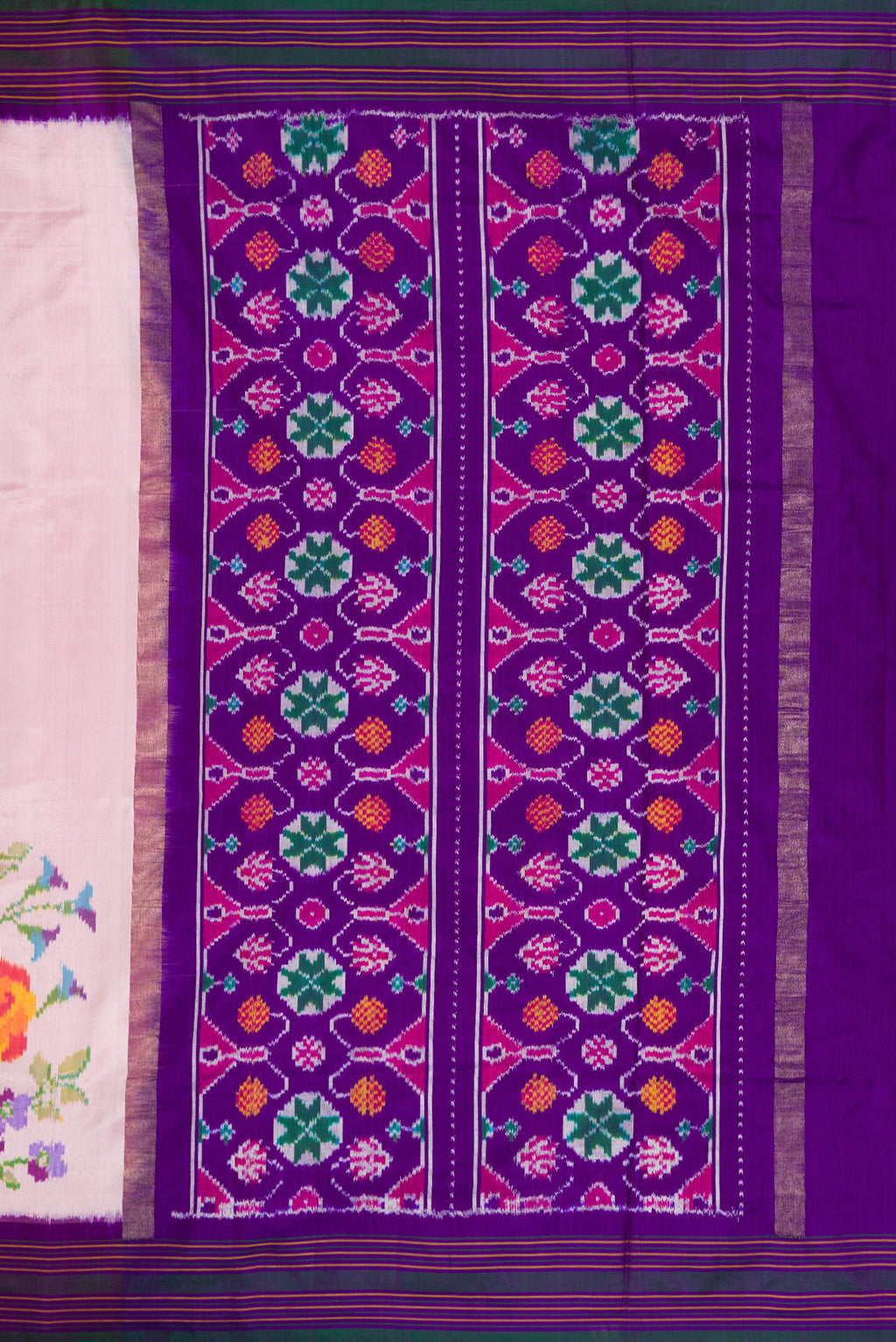 Close up image of the pallu of Pink Double Ikat Saree with Plain Body and Ikat Border. 