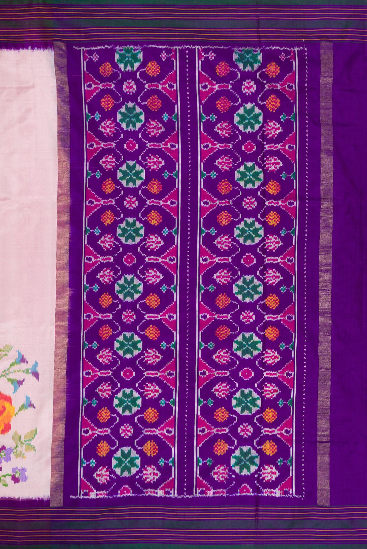 Close up image of the pallu of Pink Double Ikat Saree with Plain Body and Ikat Border. 